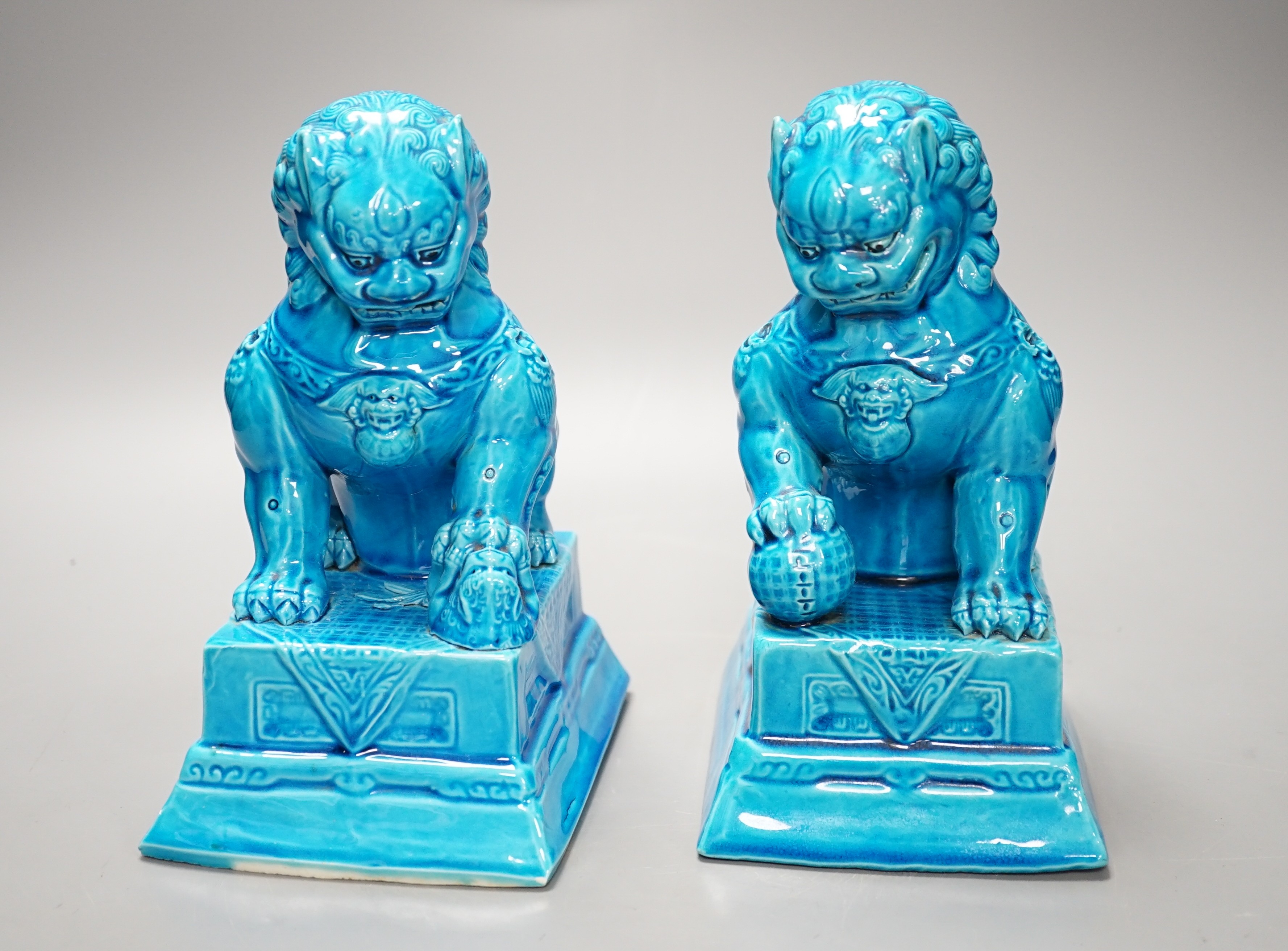 A pair of Chinese turquoise glazed temple lions 21cm